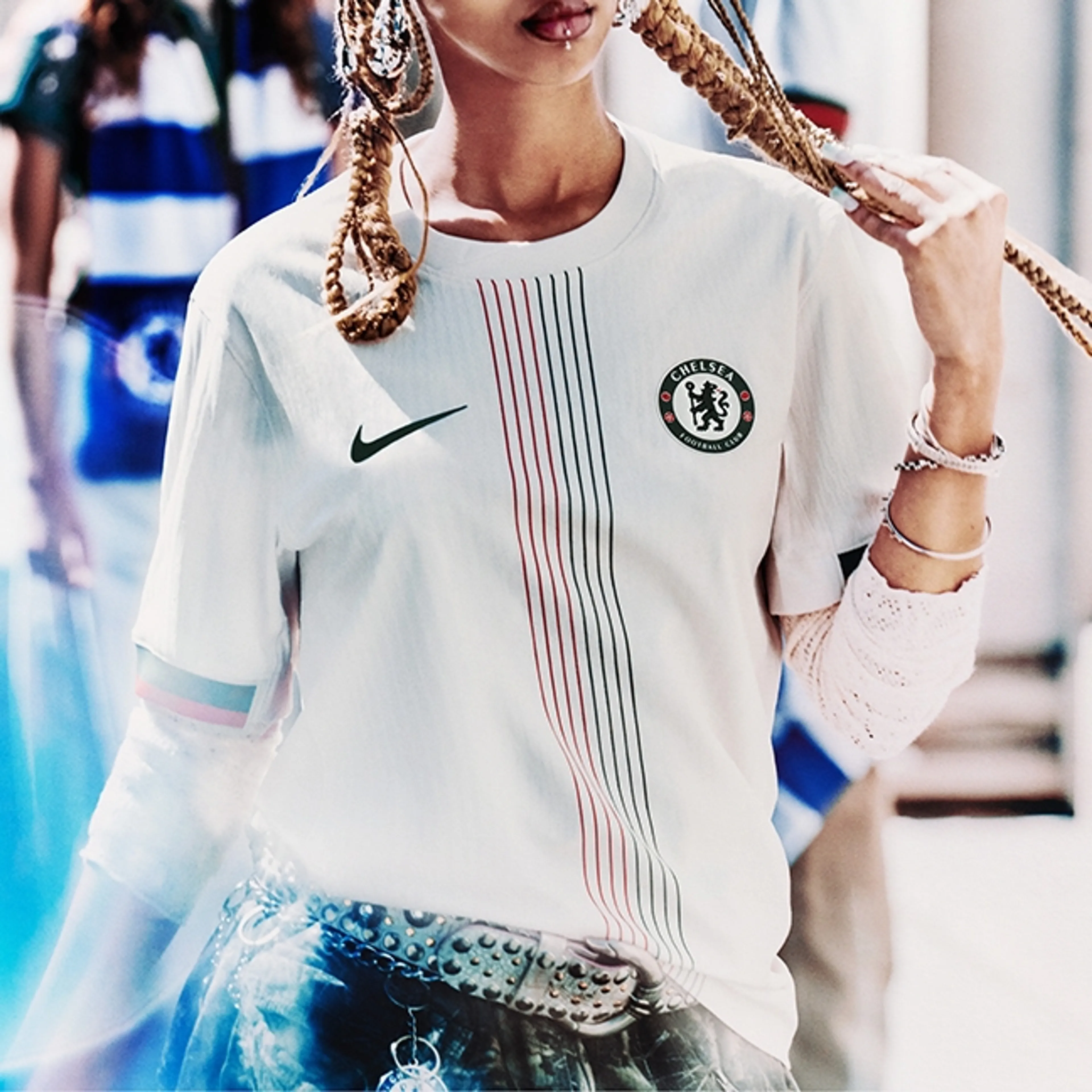 A picture of a woman in Chelsea's Away Shirt 2025/2026